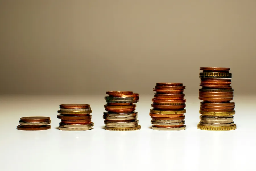 Stacks of coins rising from left to right