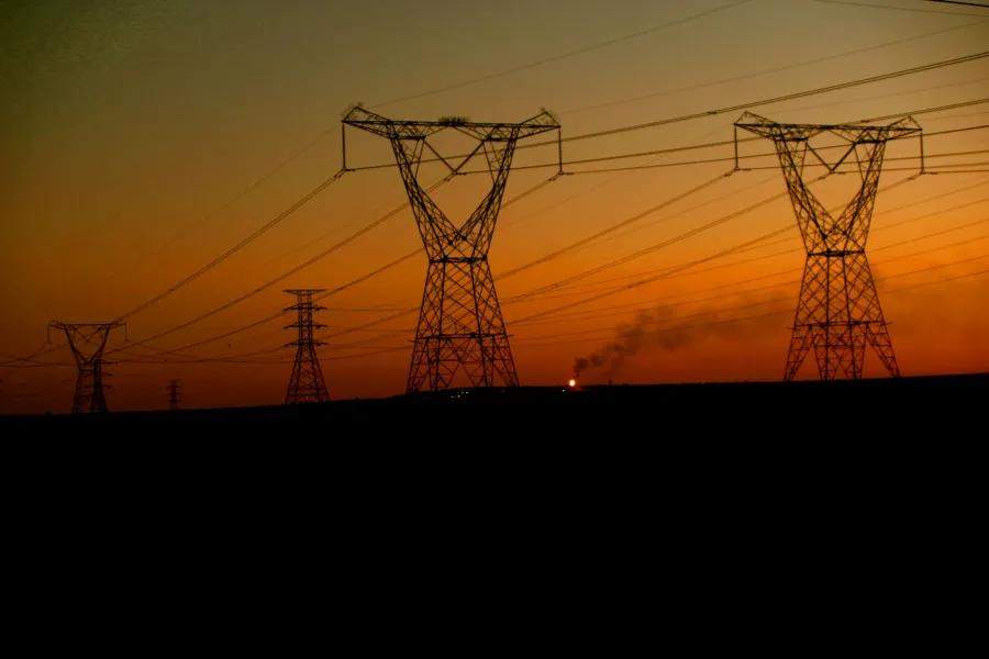 Electrical transmission towers at sunset