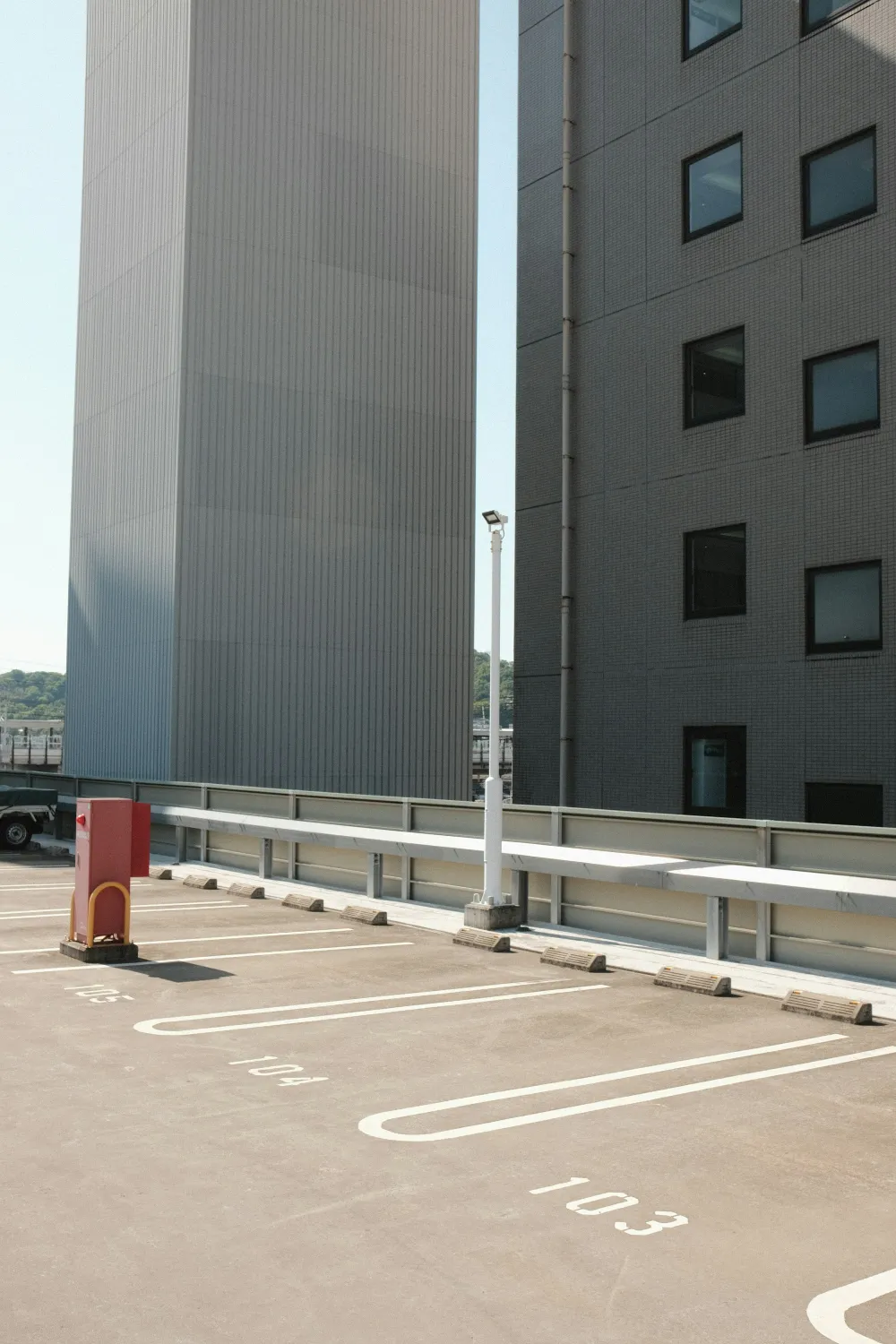 A parking deck beside a modern office building