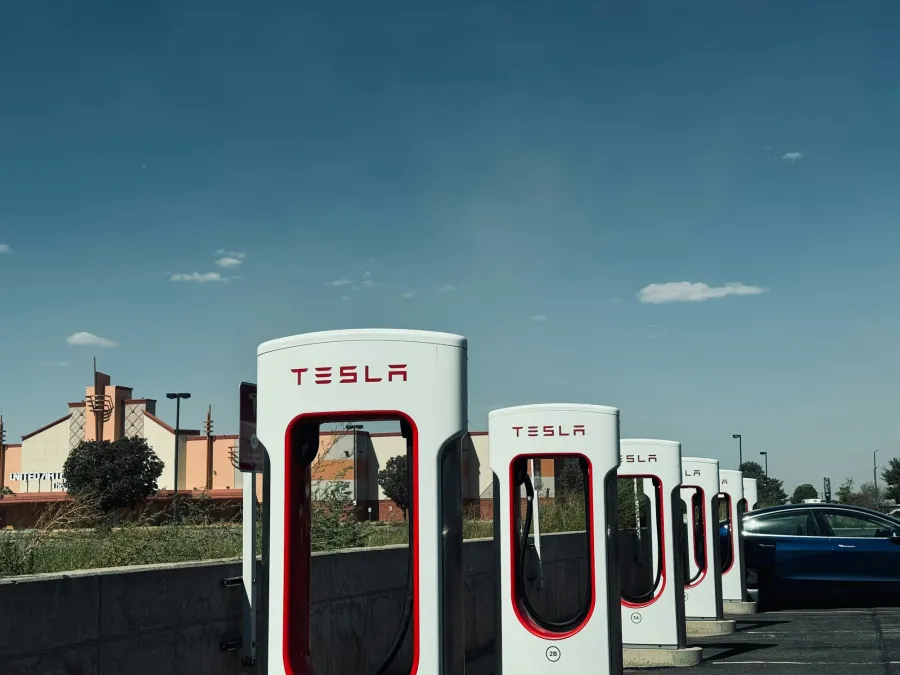 A row of Tesla Superchargers in daylight